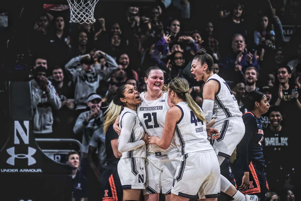 Women's basketball players celebrating on the court