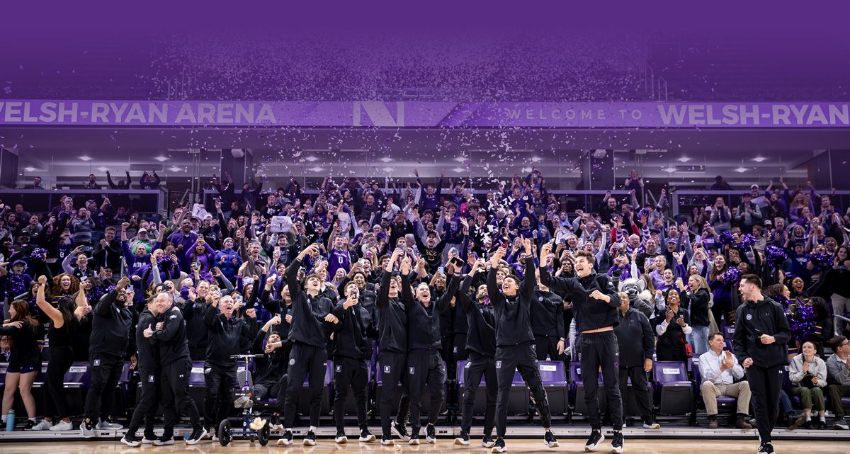 Women's basketball players celebrating on the court