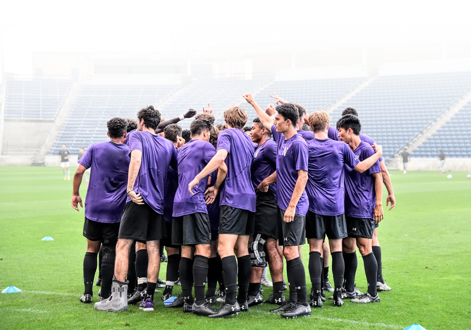Soccer players in a huddle