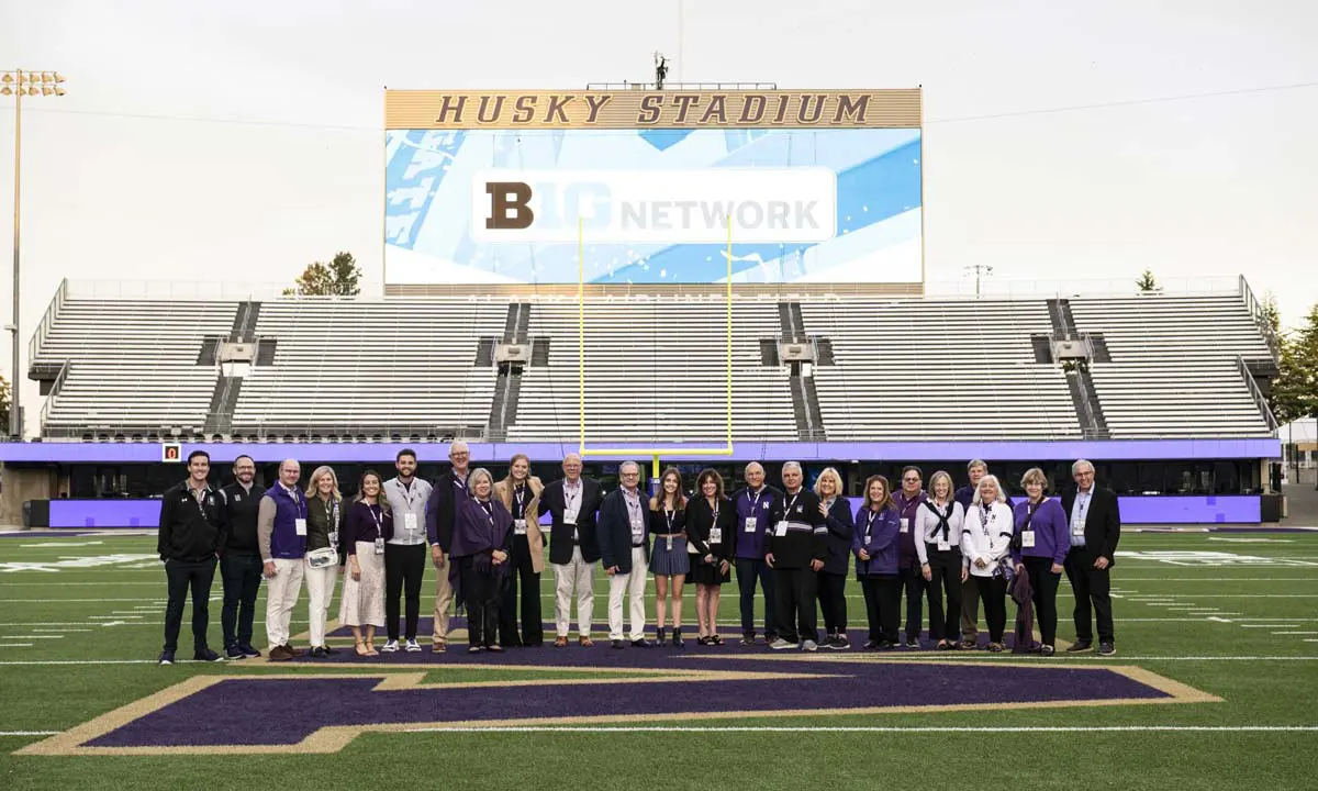 supporters standing in endzone for photo